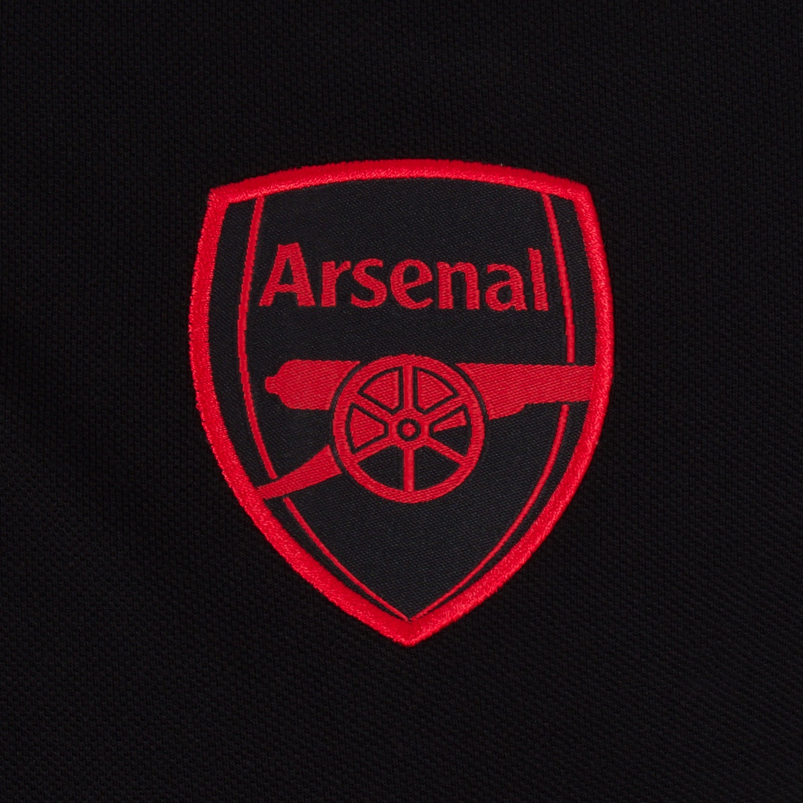 Arsenal polo shirt for adults in black featuring the club crest and Champions 2026 graphic to the chest