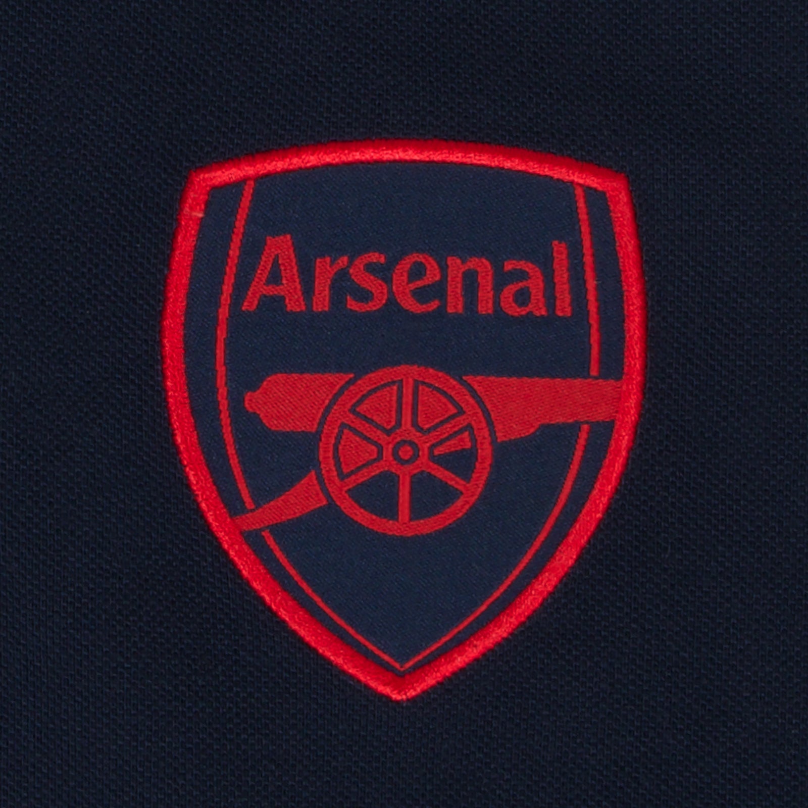 Arsenal polo shirt for adults in navy blue featuring the club crest and budapest 2026 graphic to the chest