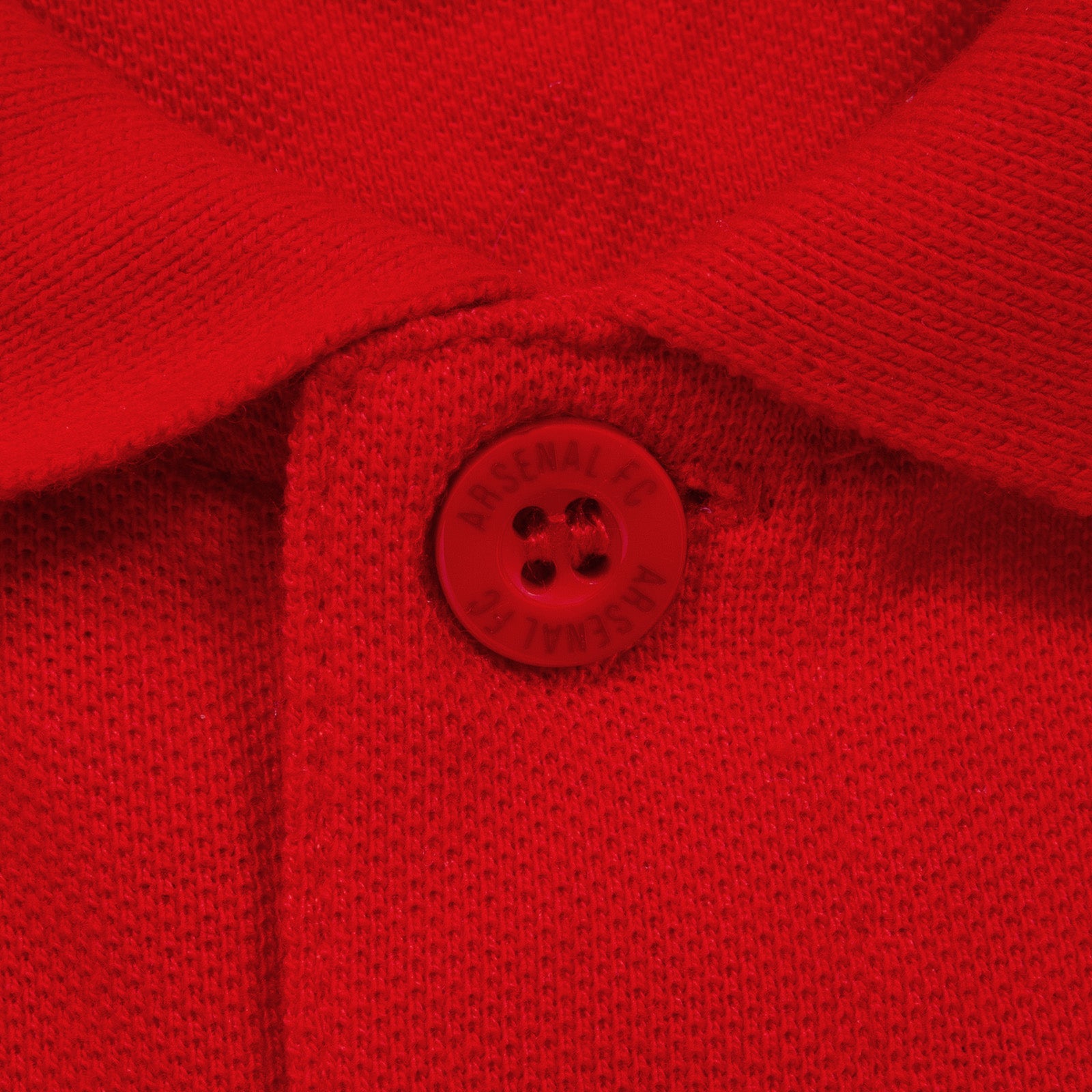 Arsenal polo shirt for adults in red featuring the club crest and Champions 2026 graphic to the chest