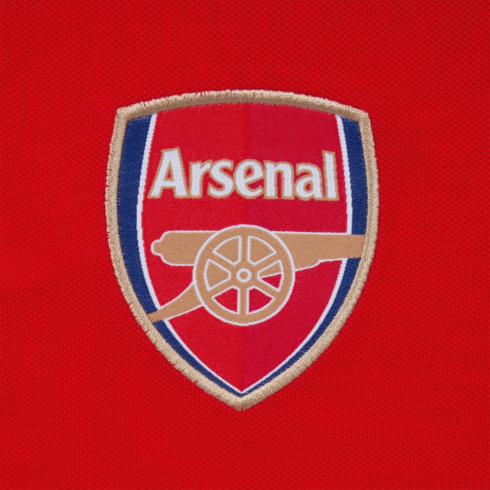 Arsenal polo shirt for adults in red featuring the club crest and Champions 2026 graphic to the chest