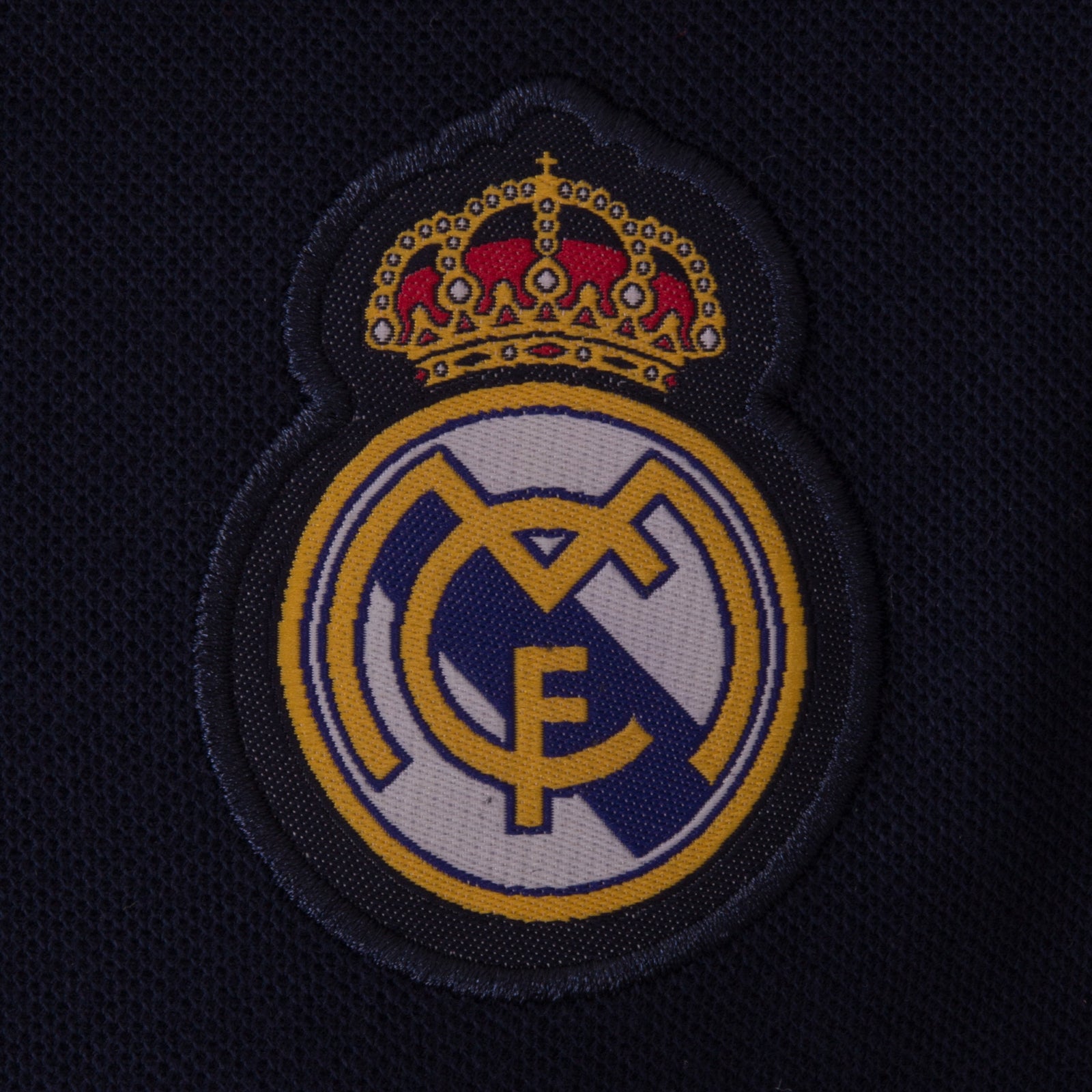 Real Madrid kids polo shirt in navy blue with club crest to chest.