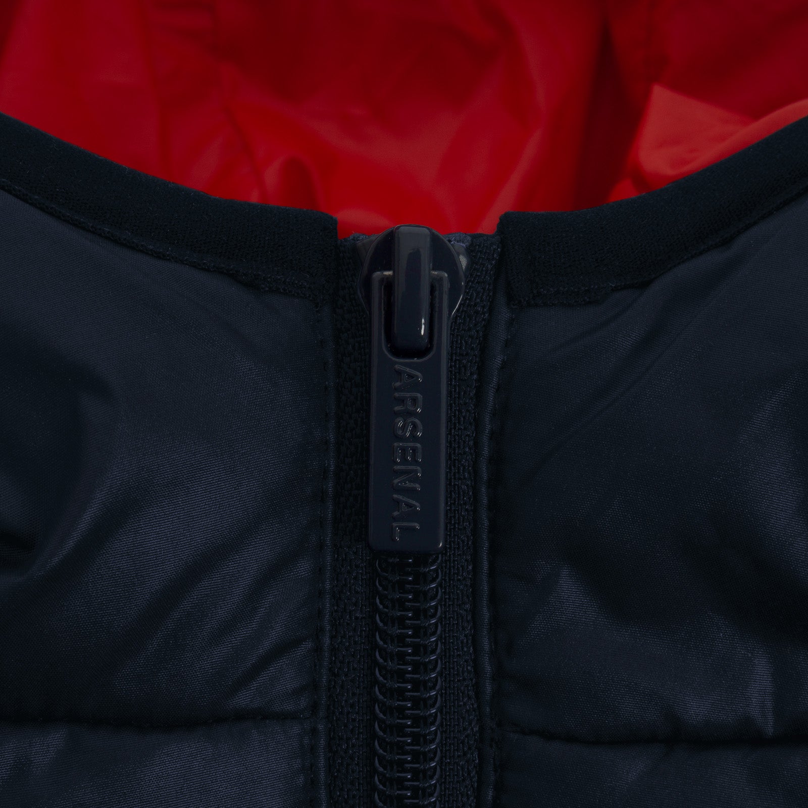 Arsenal adults quilted jacket in navy blue with club crest to chest.