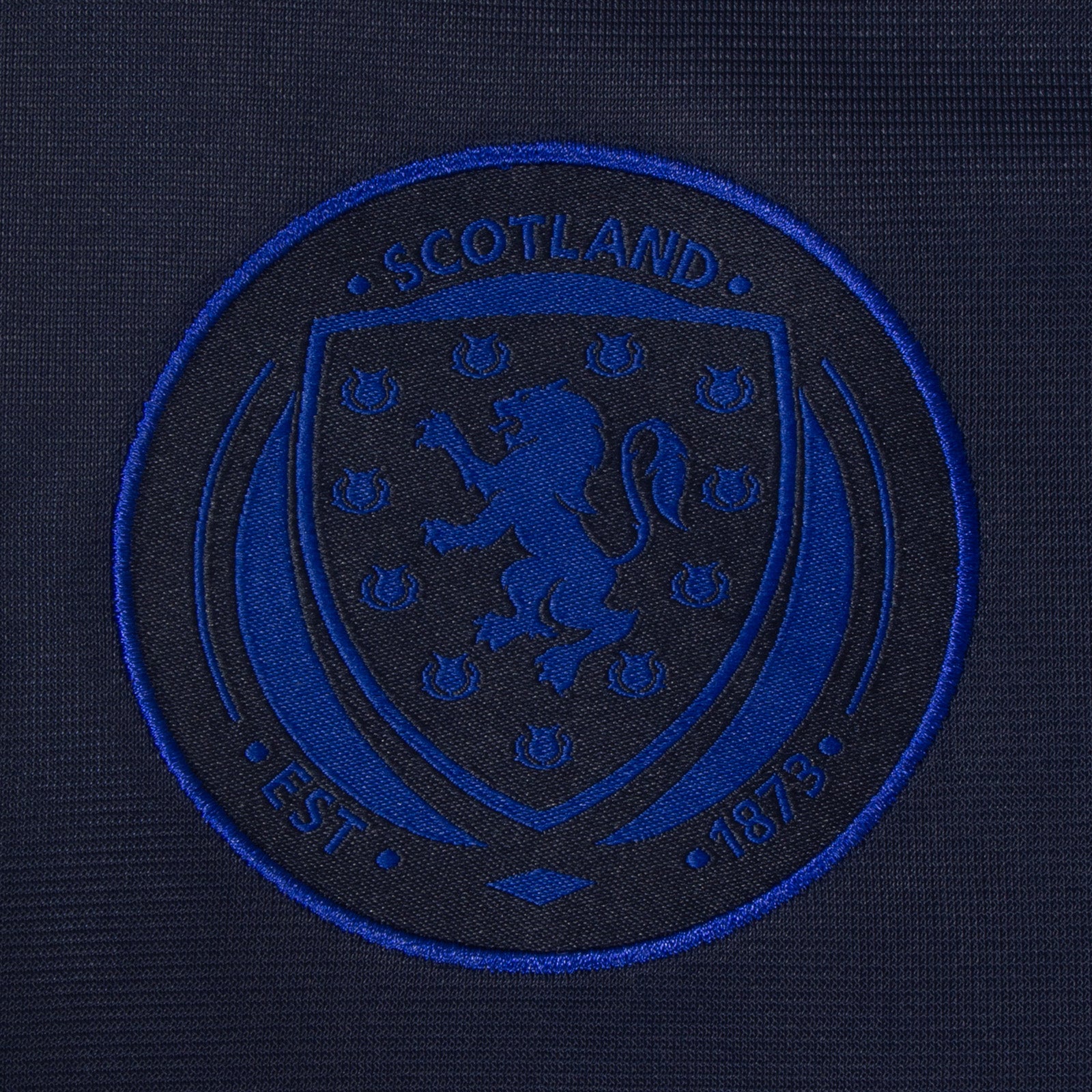 Scotland adults taped tracksuit in navy blue with SFA team crest and text to both top & pants