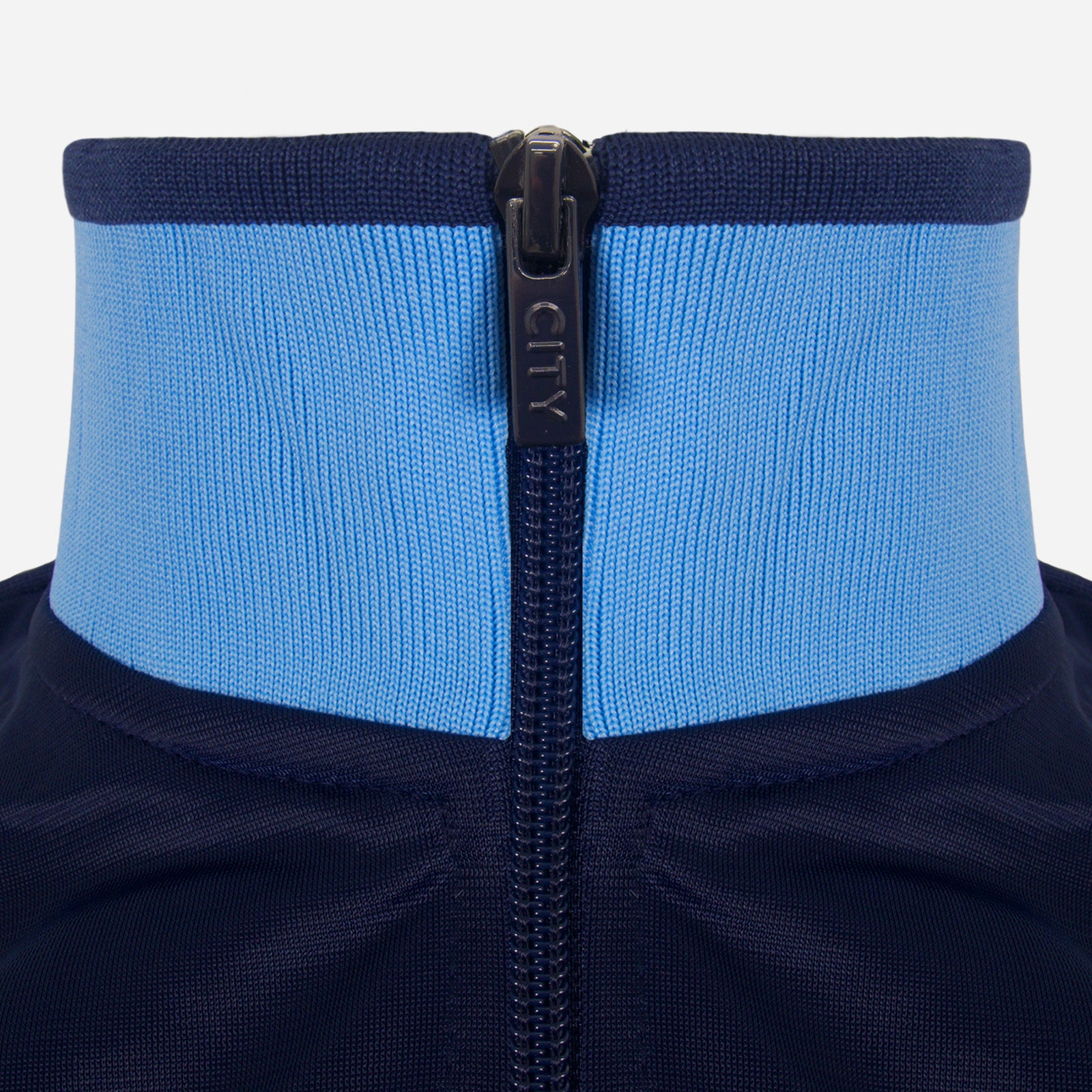 Man City adults retro track jacket in navy & sky blue with club crest to chest.