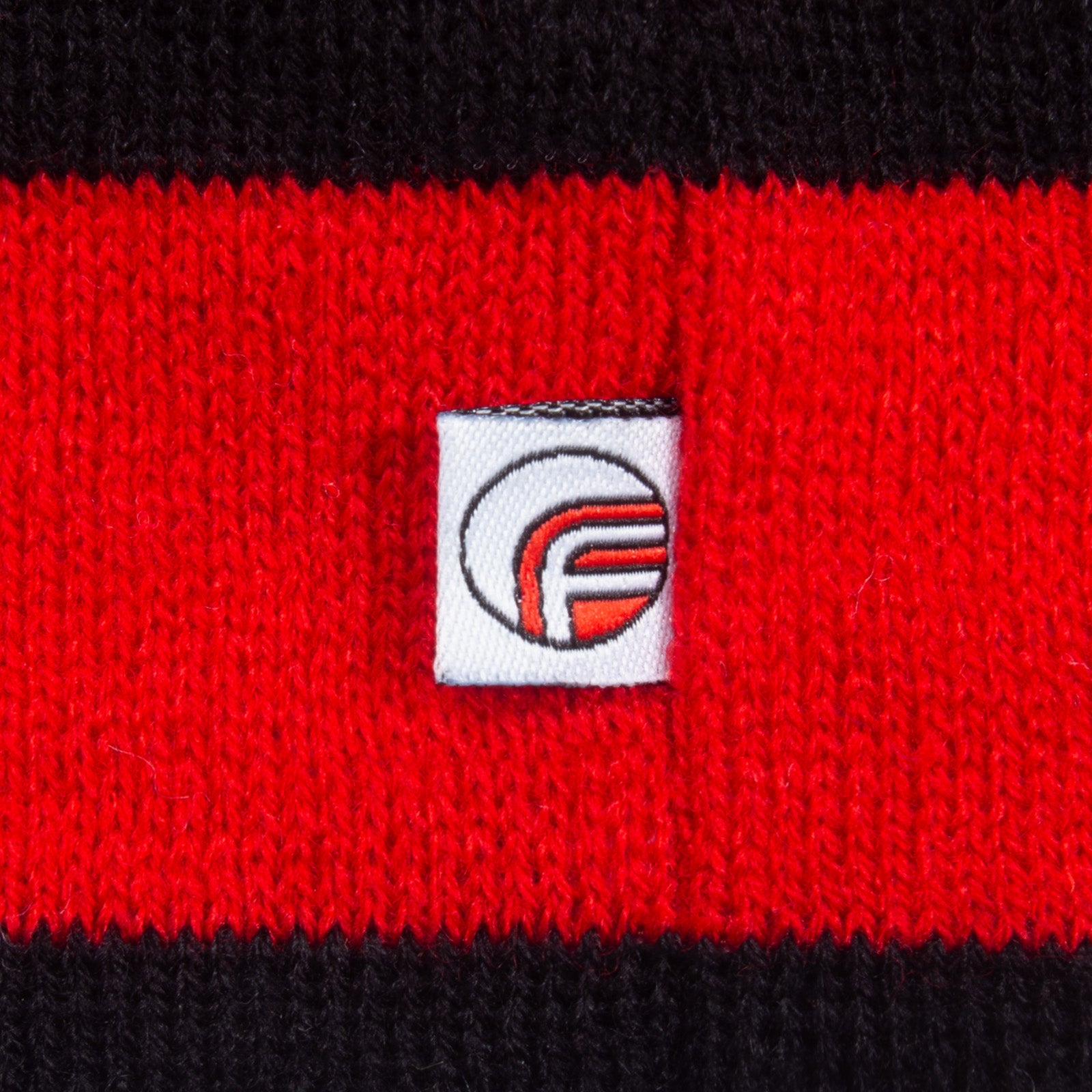 Man United knitted bobble hat in red with text & trident to front