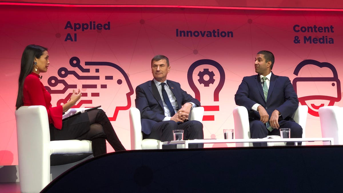 FCC Chairman Ajit Pai (right) and EU Commissioner Andrus Ansip (center) have differing views on regulating the mobile industry.