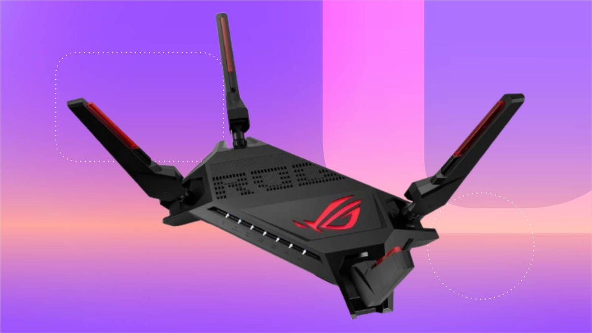Black wifi gaming router sprawled against a gradient purple background