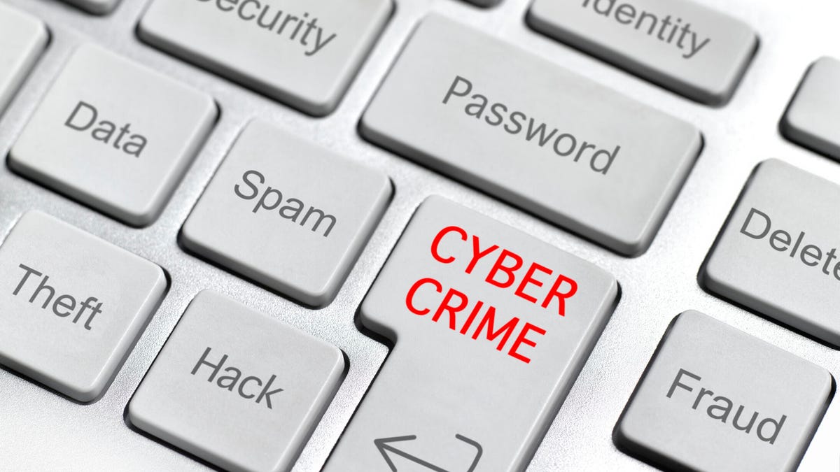 An image of a computer keyboard and thew words "cyber crime/"