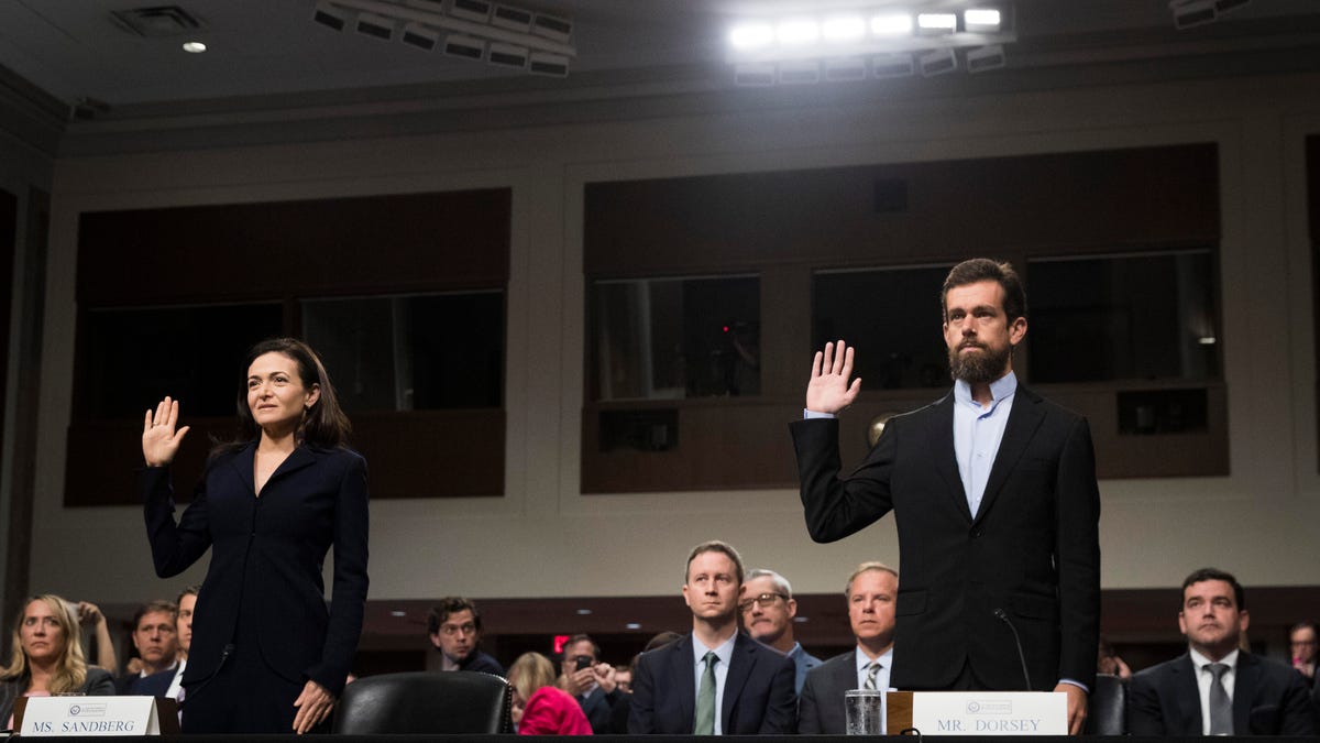 Facebook COO Sheryl Sandberg and Twitter CEO Jack Dorsey were sworn in before their testimony to the Senate intelligence committee.