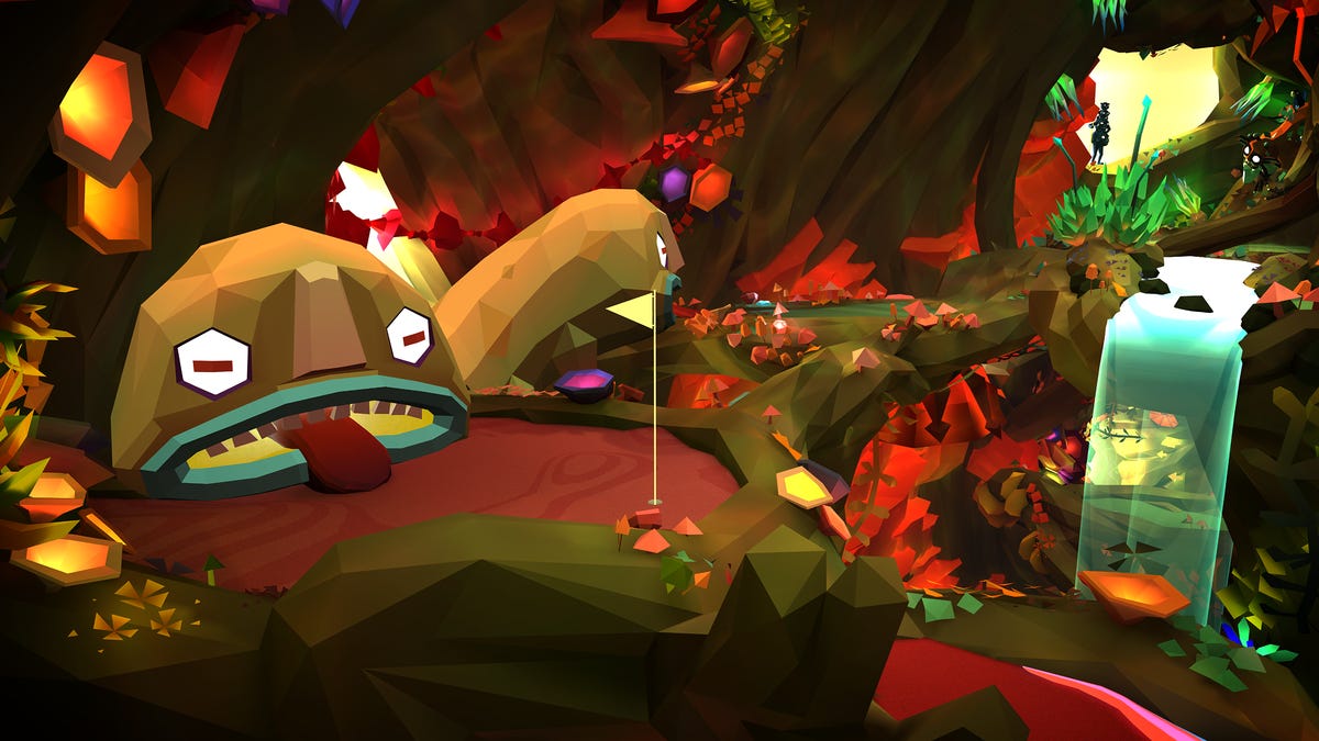 A video game mini golf hole with a creature that has a big open mouth near the hole