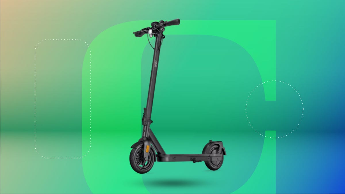 The VMax VX5 electric scooter is displayed against a green background.