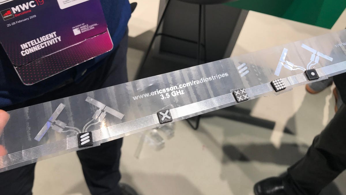 This plastic strip holds little plastic circuit boards and antennas for 5G signals.