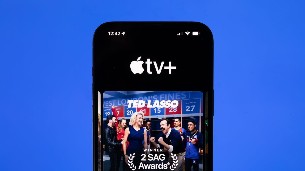 An iPhone shows Apple TV Plus's page for Ted Lasso