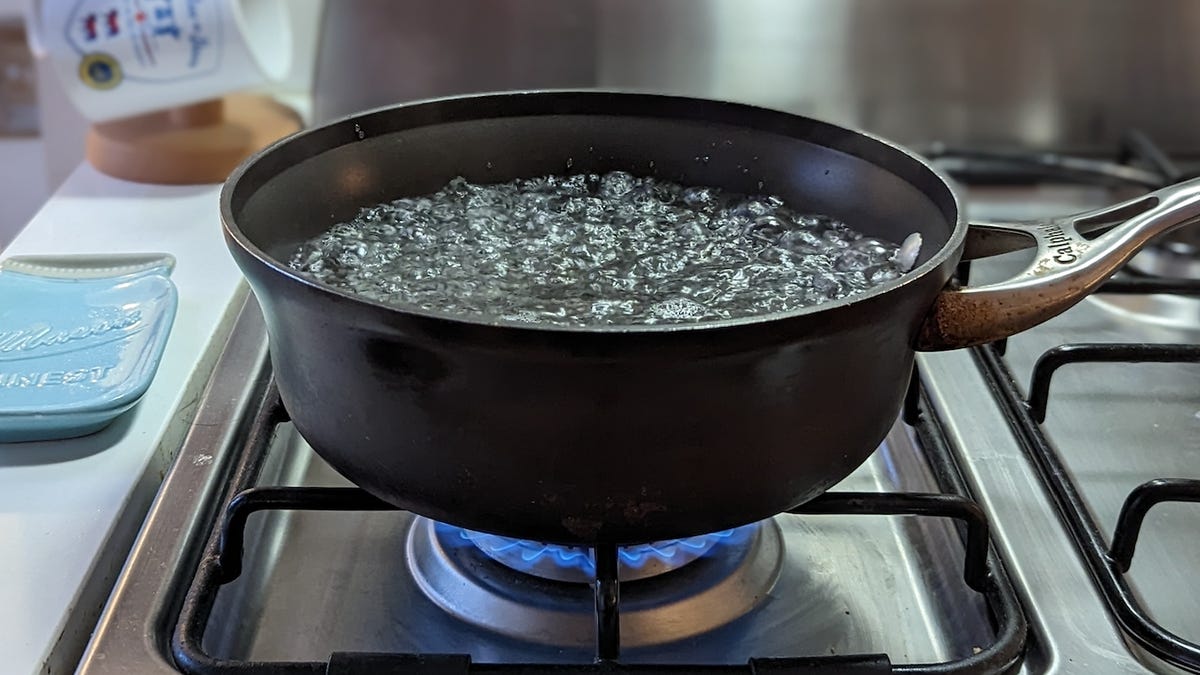pot of boiling water over stove burner