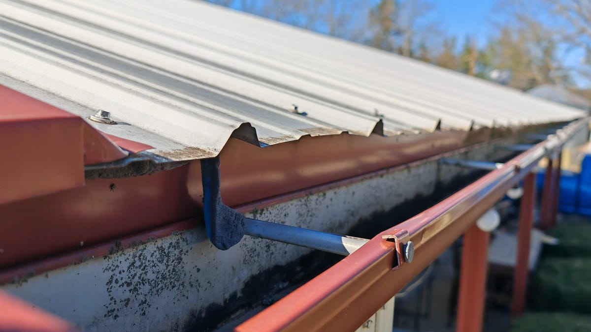 looking inside of dirty gutters