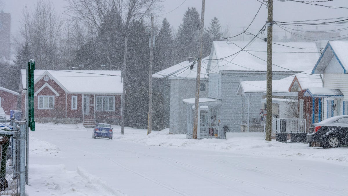 Streets and buildings covered with snow in a small town