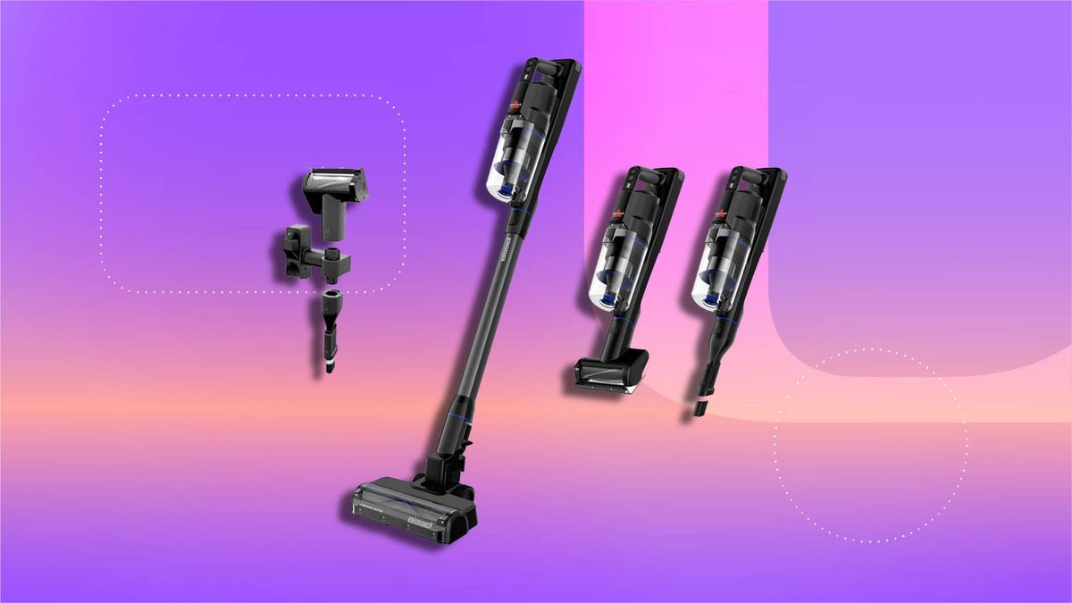 A Bissell cordless vacuum with various attachments on a CNET background.