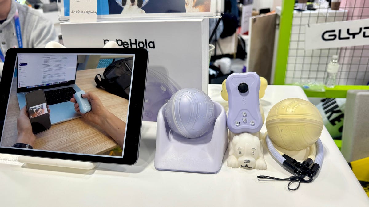 PePeHola interactive dog toy and remote control displayed at the CES booth