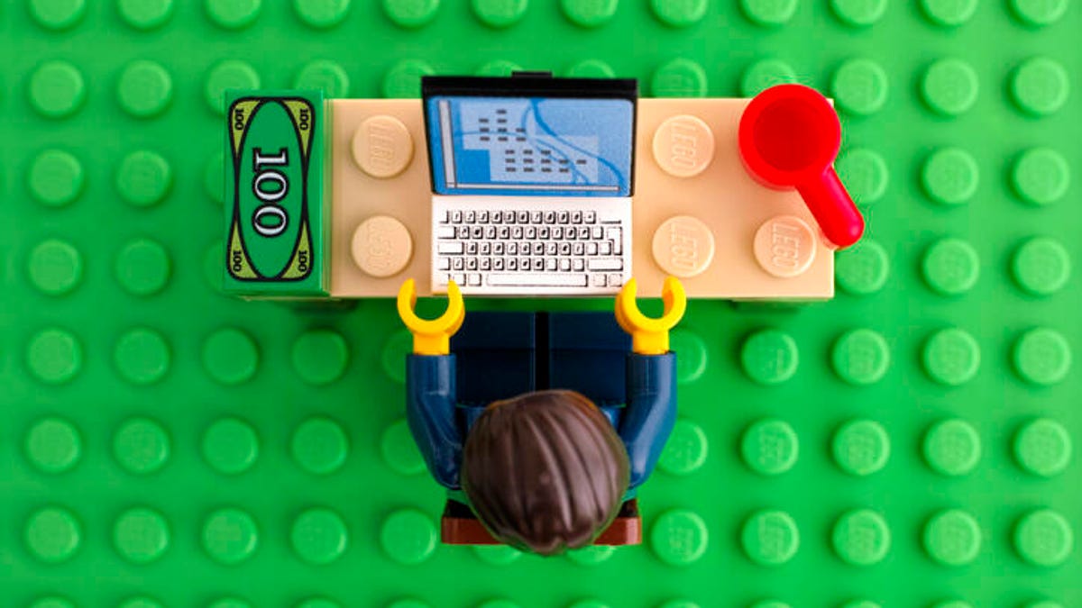 Lego person working at a computer