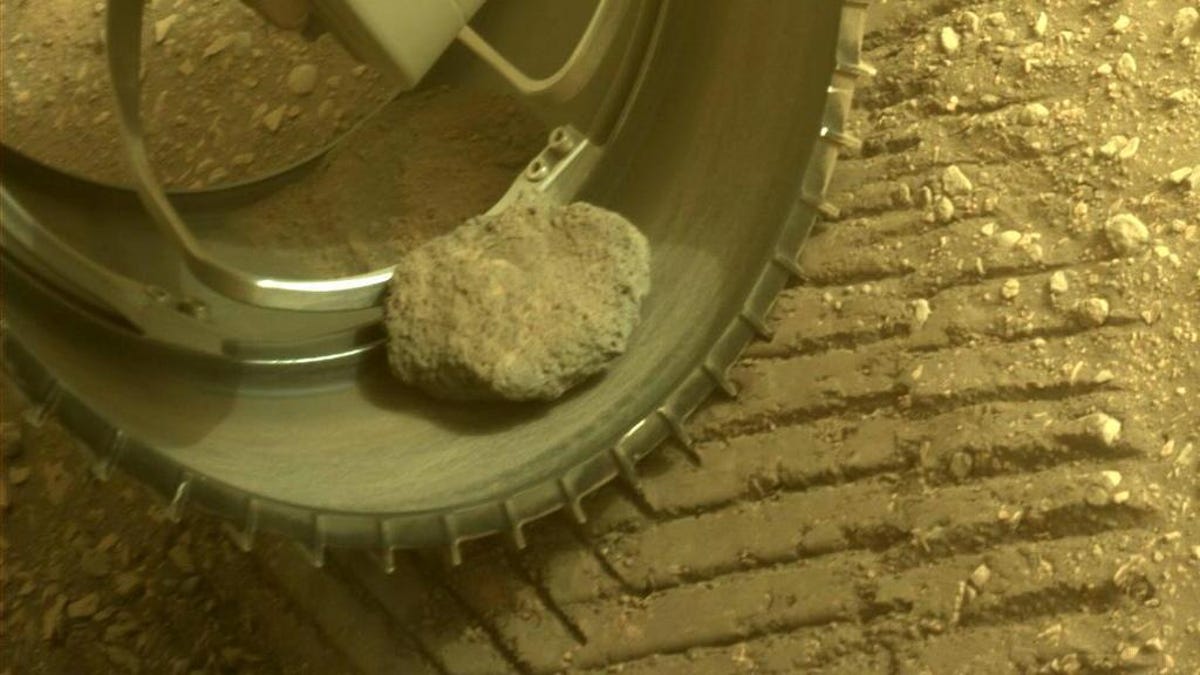 A rock stuck in the wheel of the Perseverance Mars rover
