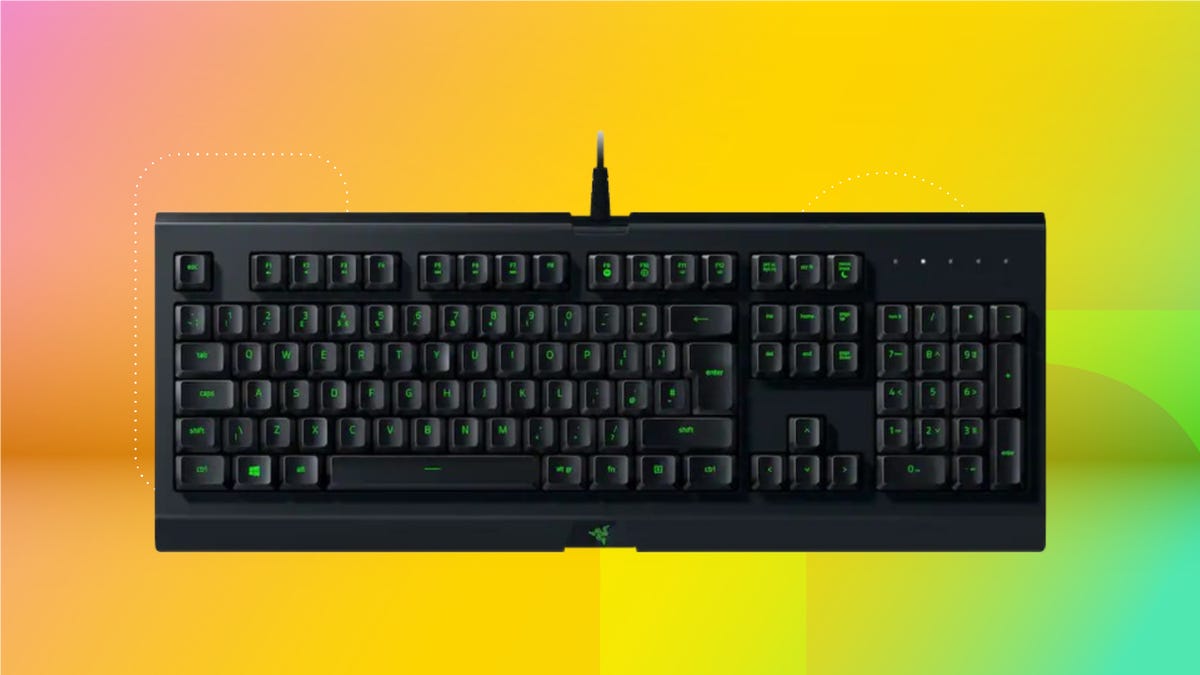A black Razer Cynosa keyboard on a pink, yellow and green background