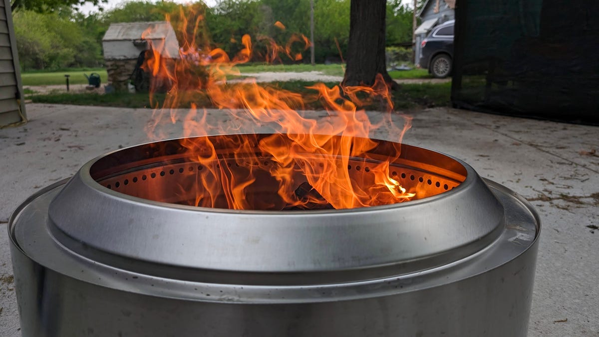 A smokeless fire pit sits outside