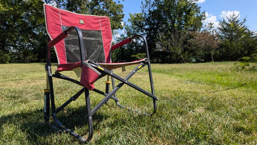 GCI Freestyle Camping Chair unfolded and sitting in the grass.