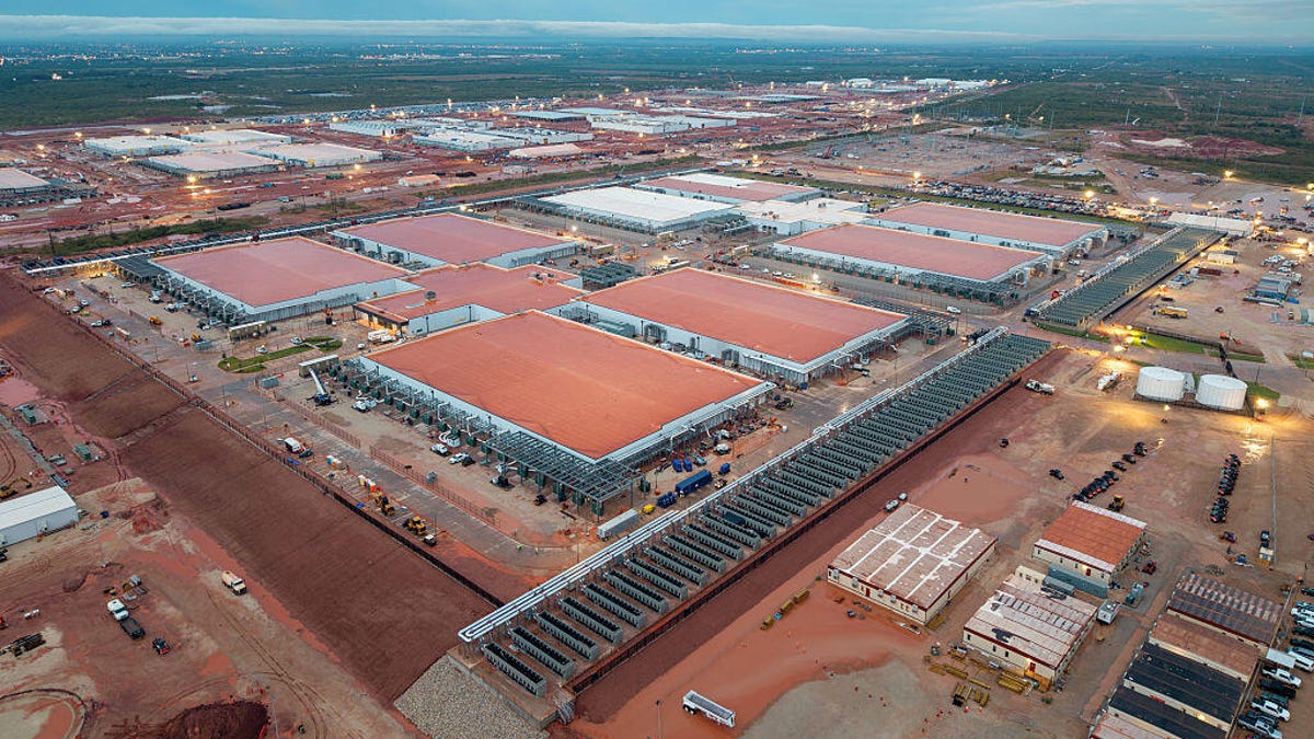 Aerial view of multiple warehouse-like buildings spreading across many acres