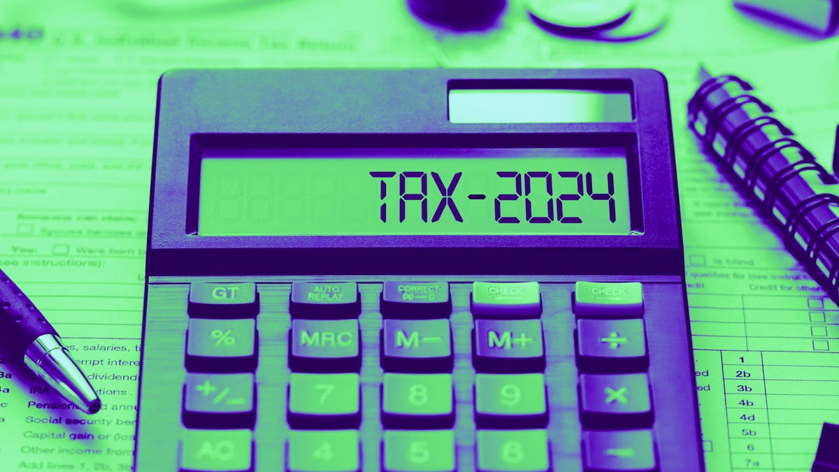 colorized dark purple calculator with the words "Tax-2024" on the screen on a green gradient background