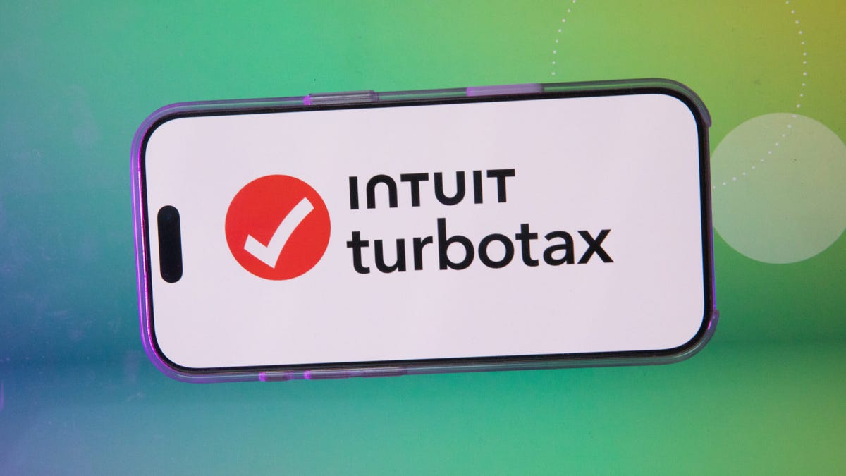 Intuit turbotax logo on a smart phone against green background