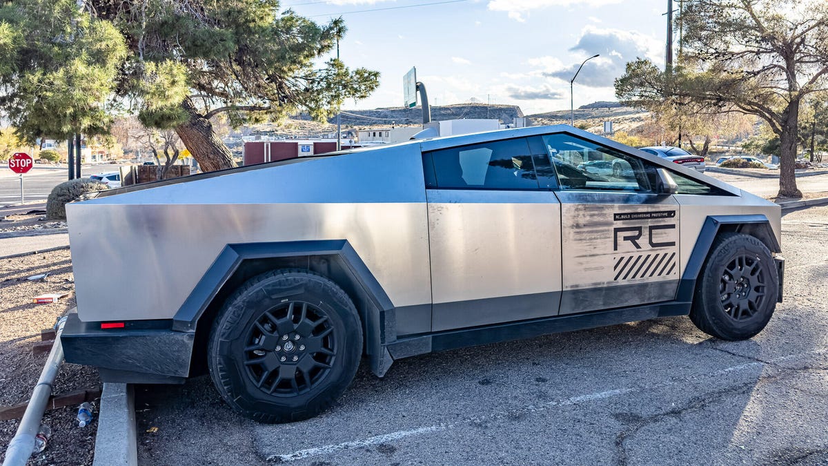 A Cybertruck charging at a Tesla Supercharger station
