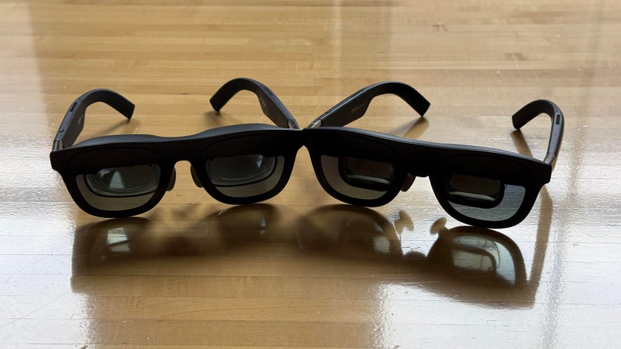 Xreal One Pro and Xreal One glasses side by side on a table