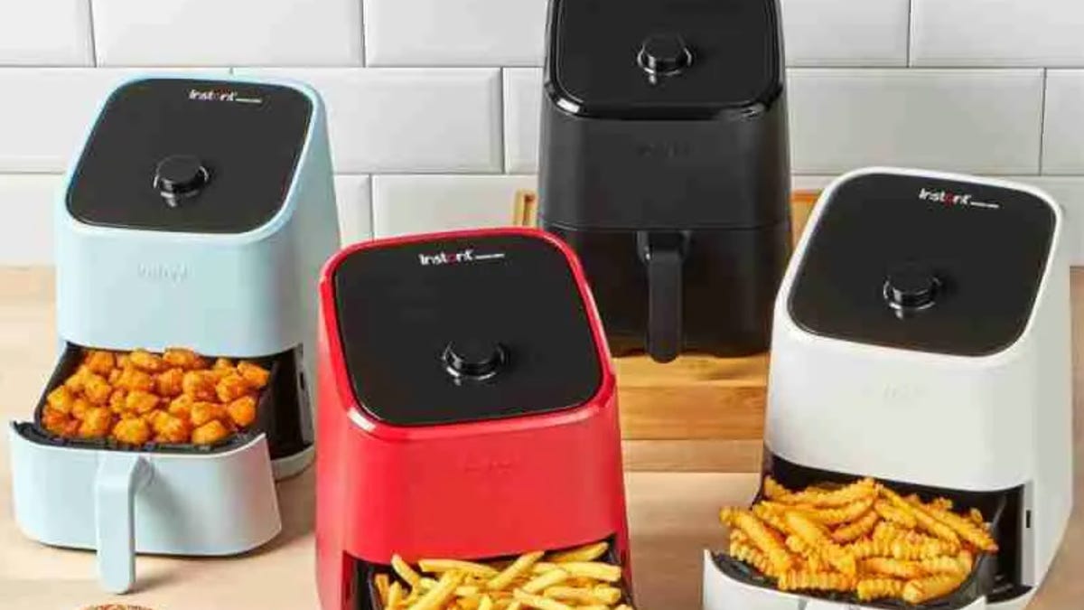 four air fryers in various colors