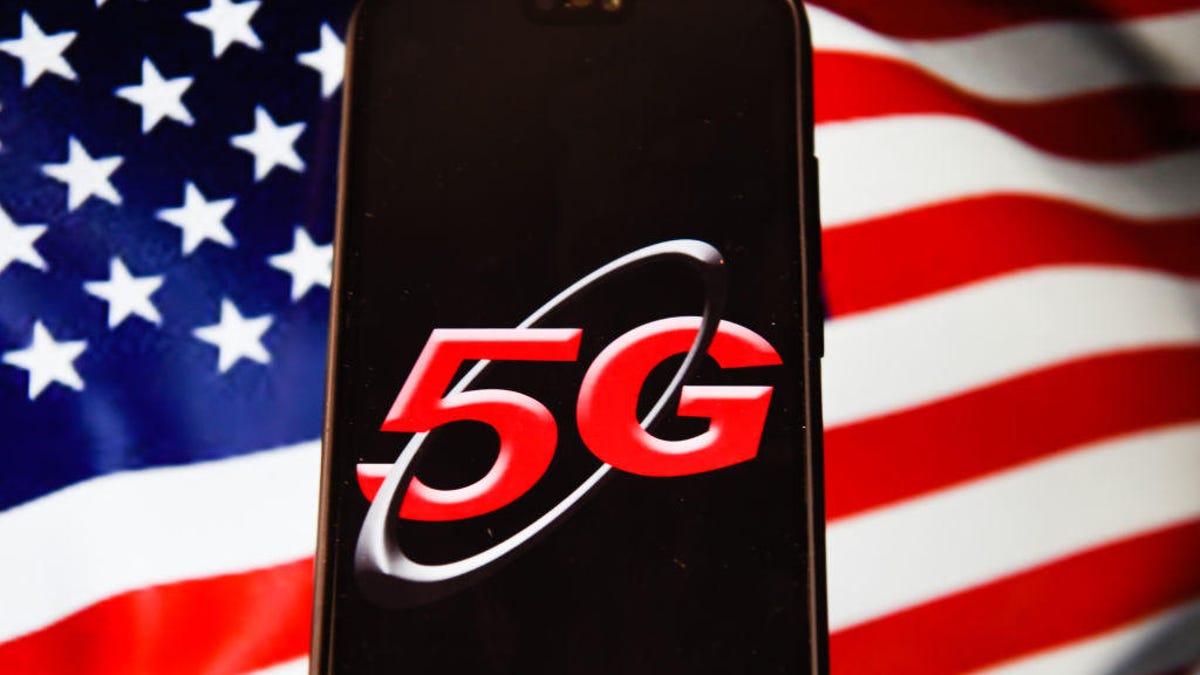 In this photo illustration a 5G logo seen displayed on a