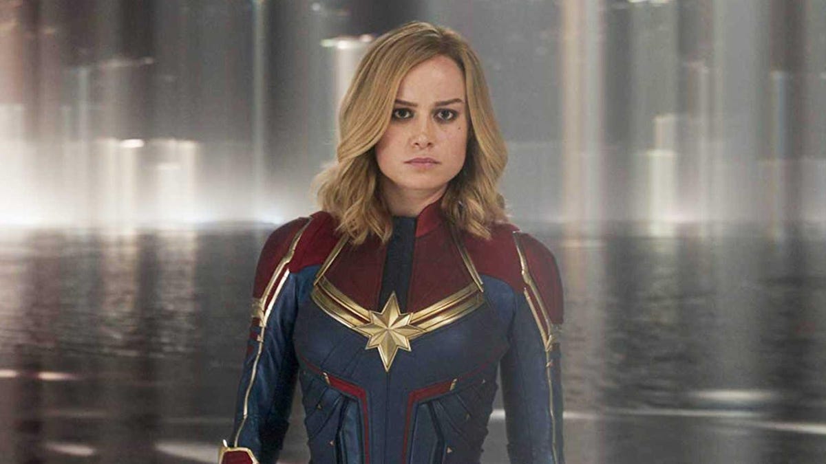 Brie Larson smoulders in her blue, red and gold Captain Marvel superhero outfit.
