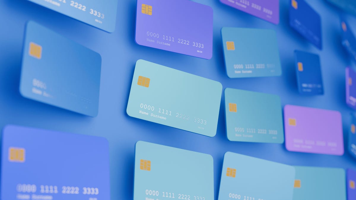 blue american express card with logo against a green and yellow background