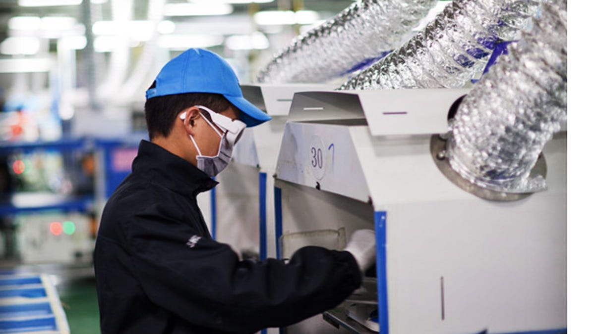 A worker at one of Apple's supplier plants