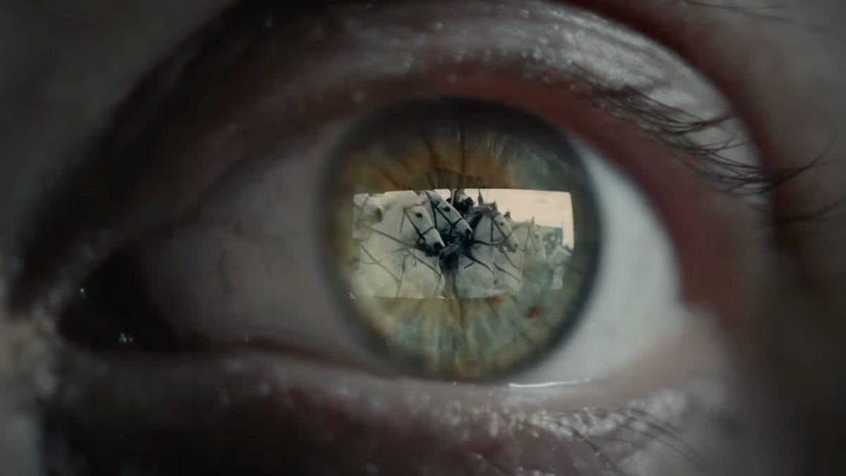 An image of an eye with a reflection of a VR headset screen in it.