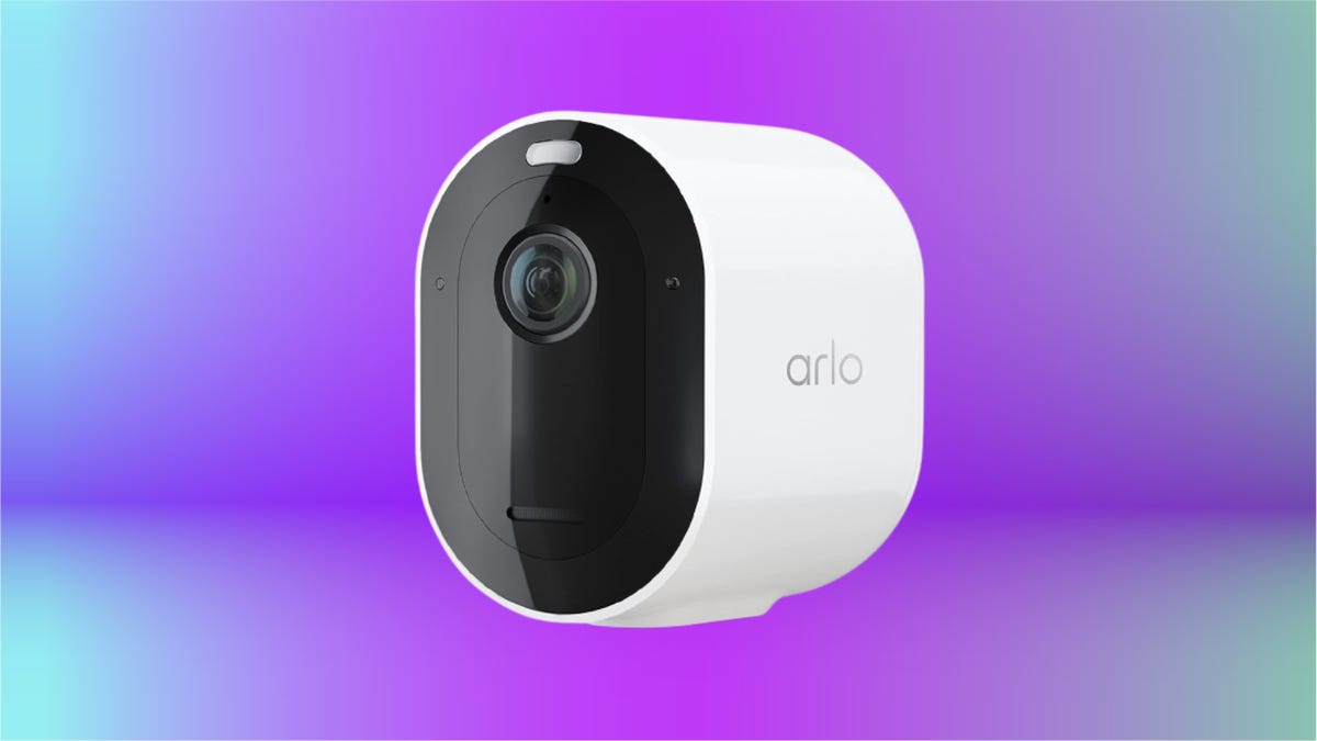 white Arlo security camera with black cover against purple and mint green gradient