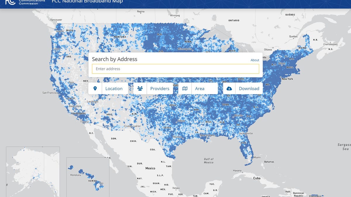 A map of the US with blue dots representing broadband coverage, with much of the country dotted blue until gaps show in broad stretches of the plains states and southwest, then a solid blue band on the west coast.
