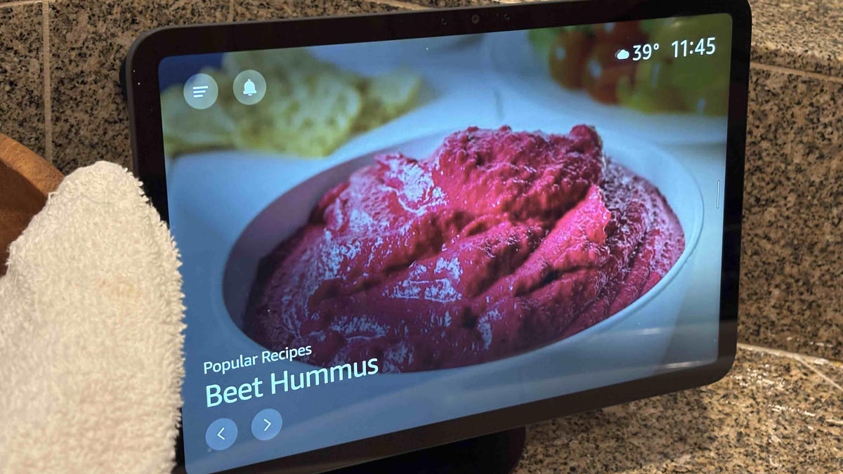 An Echo Show on a brown counter showing a recipe suggestion.