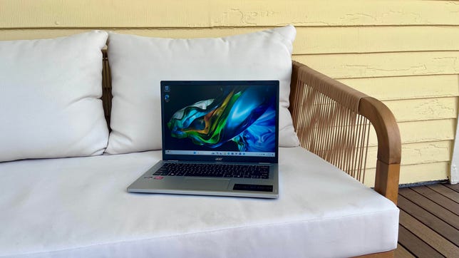 Acer Aspire Go 14 laptop on a chair on a front porch