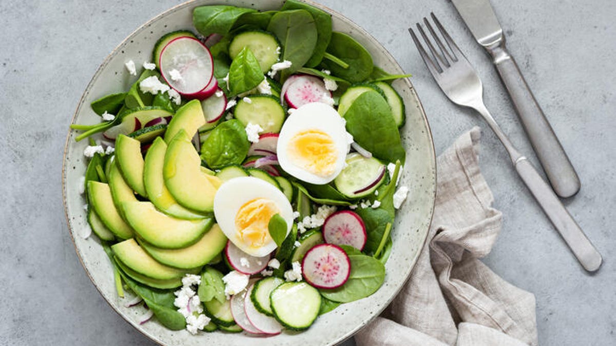 salad with egg, avocado, spinach and radishes
