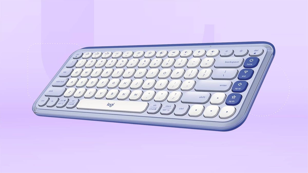 A blue and white keyboard against a purple gradient CNET background.