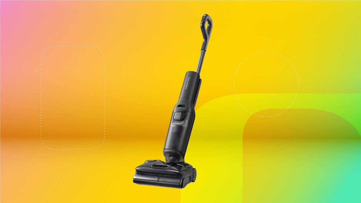 A black Roborock F25 Ultra wet/dry vacuum against a yellow gradient CNET background.