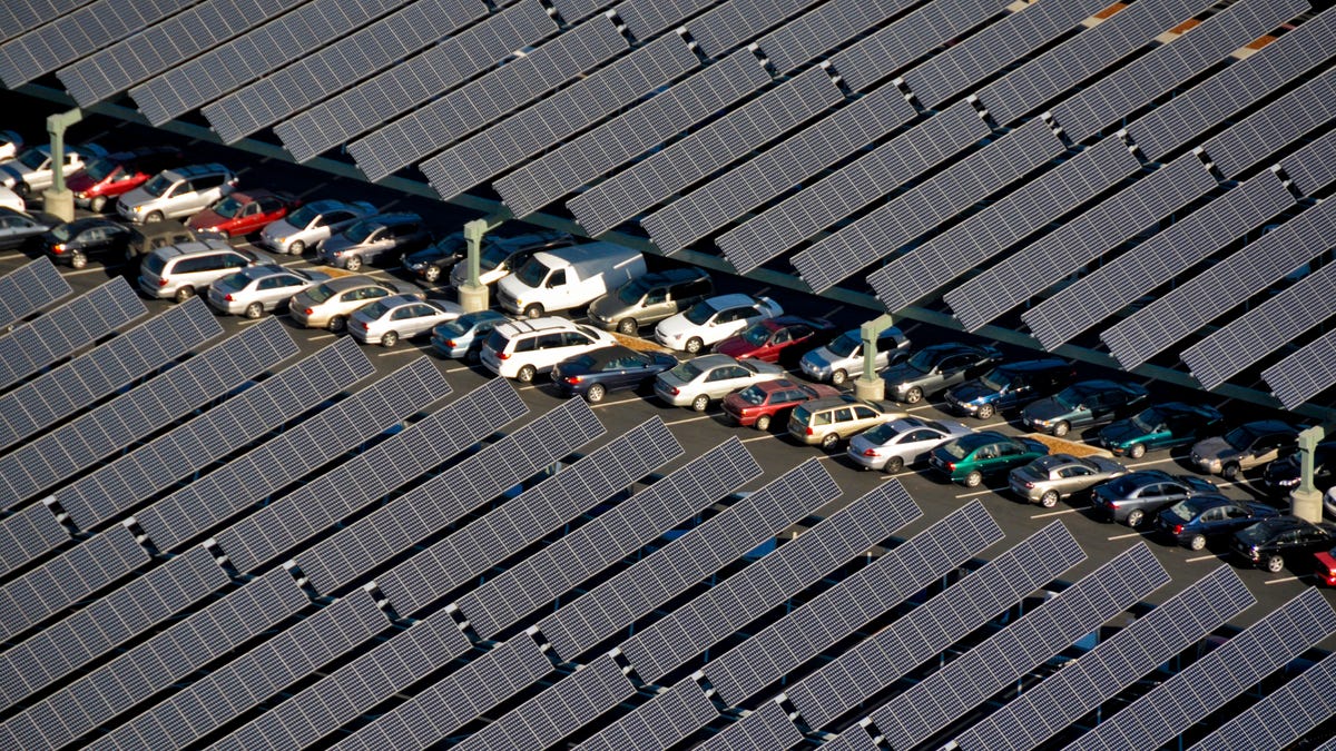 Cars parked beneath a solar canopy