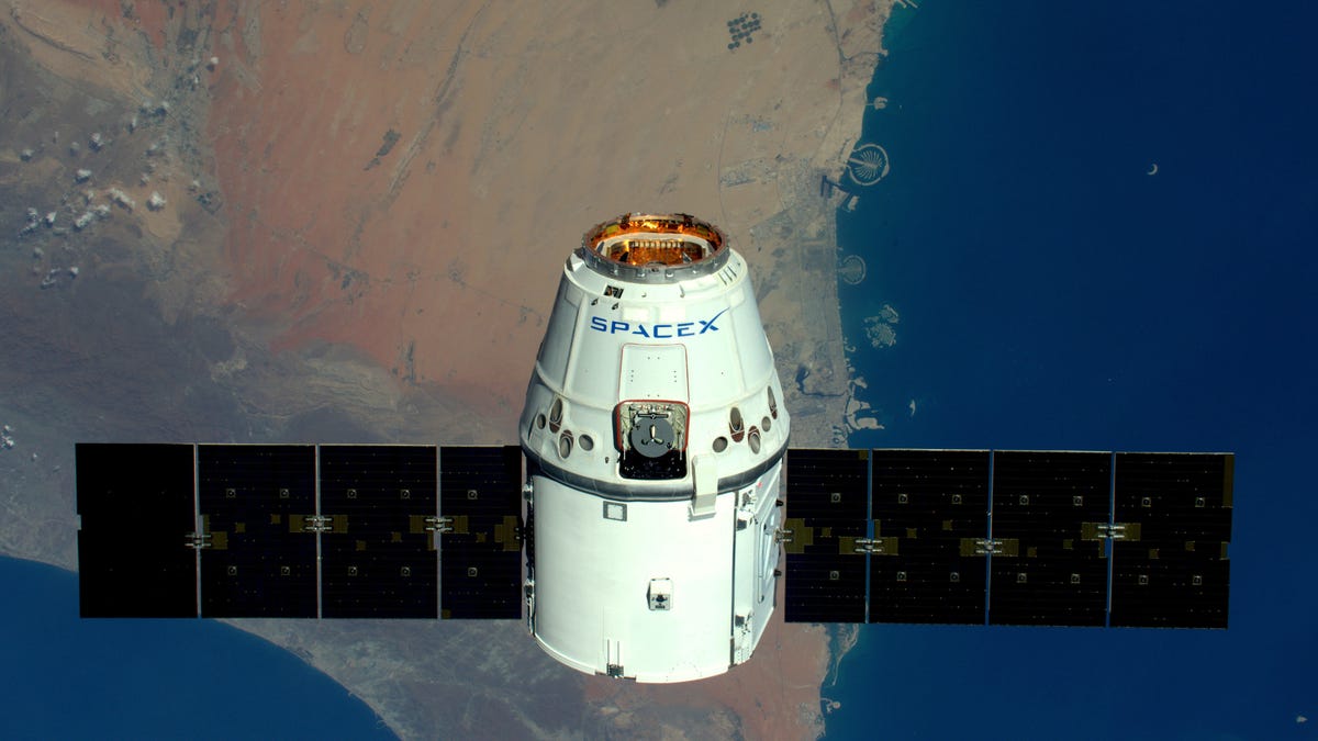 A SpaceX capsule above the Earth