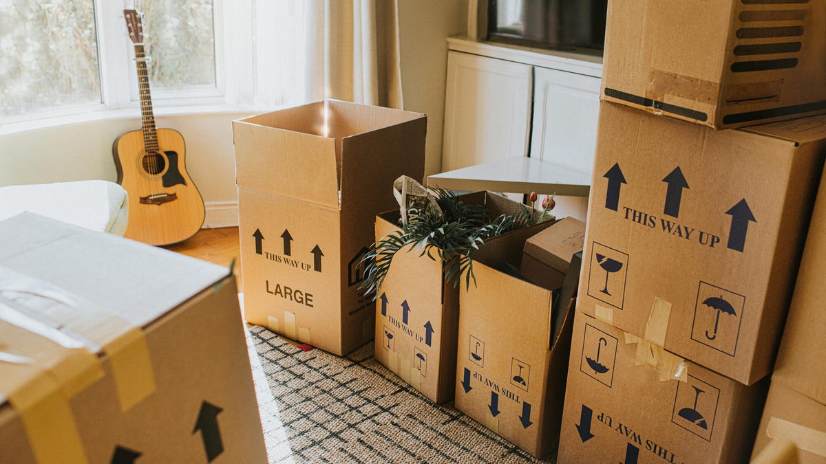Boxes sit in a living room before or after a move.