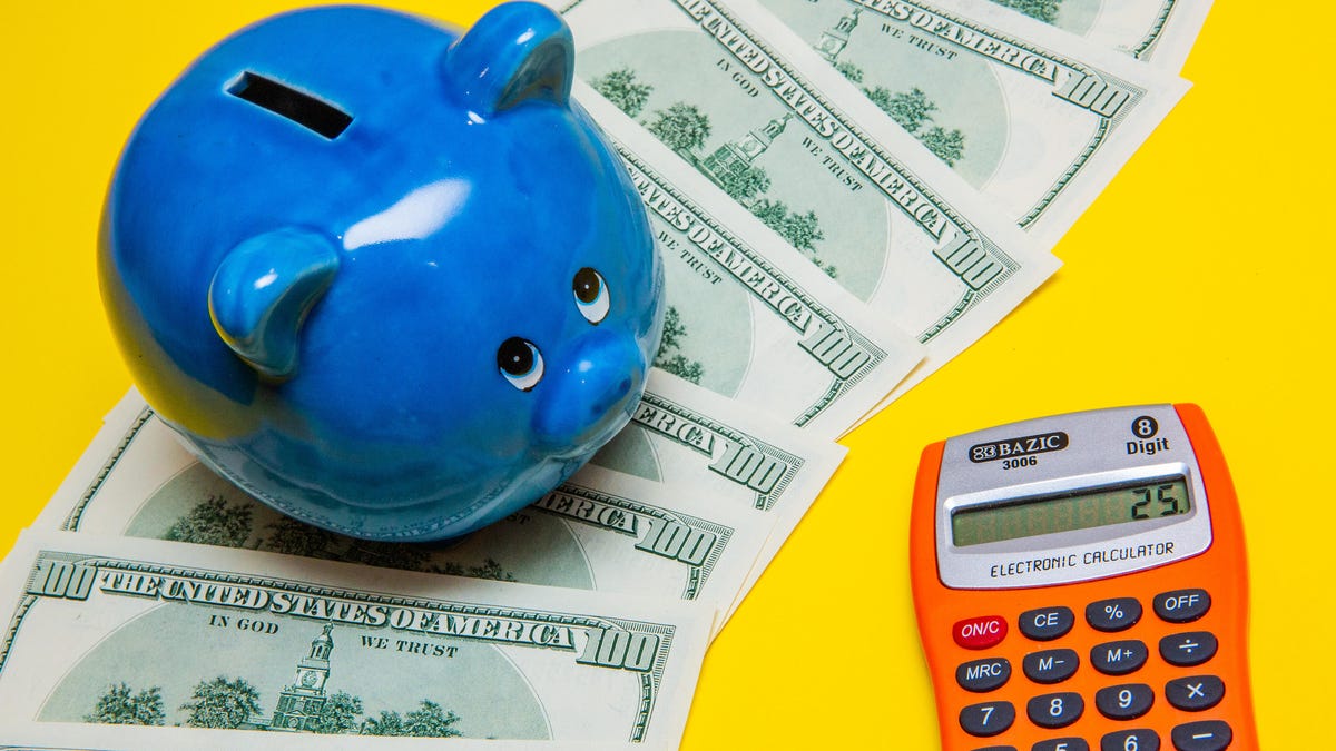 piggy bank and cash with calculator