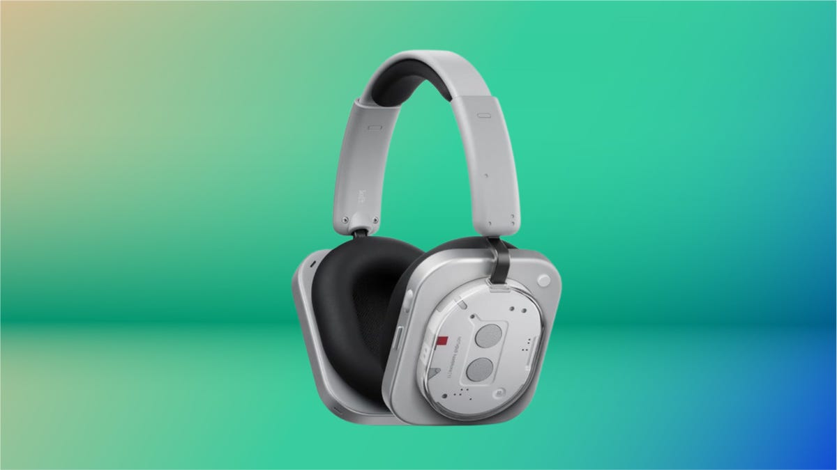 Silver Nothing headphones with black accents against blue-green background.